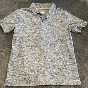 Boys size large navy and grey Under Armour polo shirt